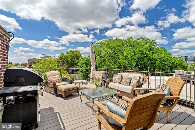 deck featuring an outdoor living space and grilling area