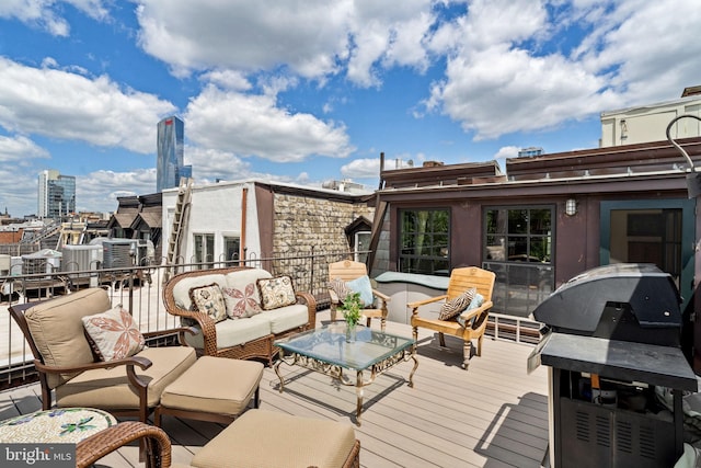 deck featuring area for grilling and an outdoor living space