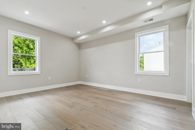 spare room with light wood-type flooring