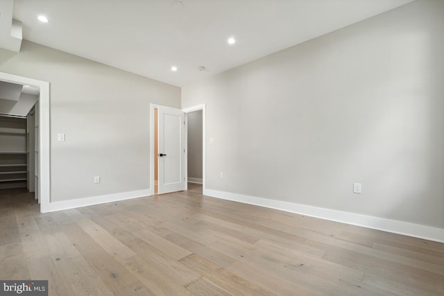 spare room featuring light wood-type flooring