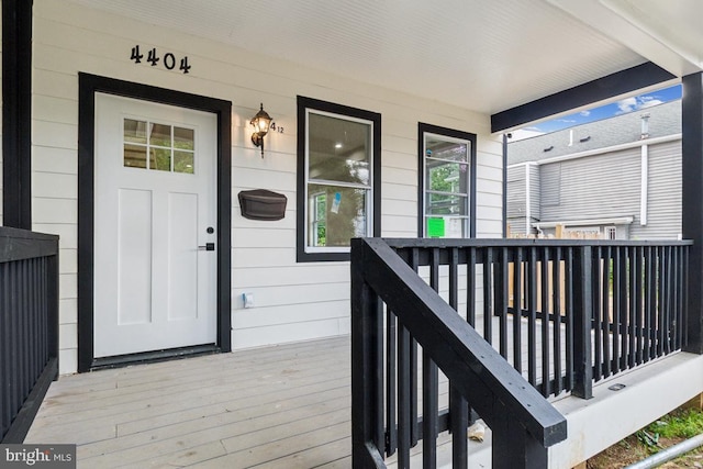 entrance to property featuring covered porch