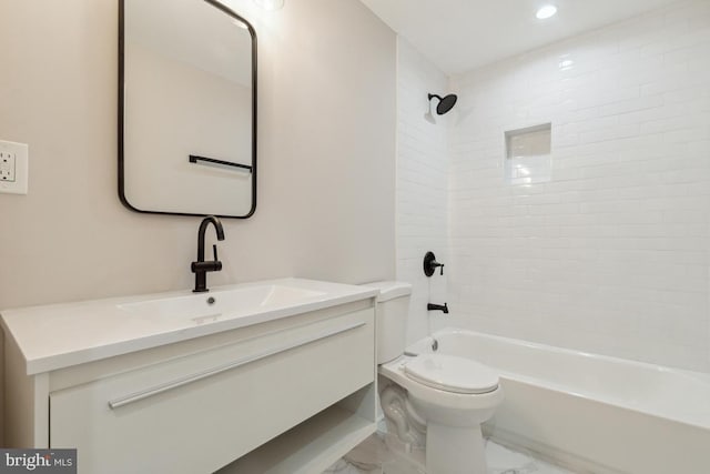 full bathroom with tiled shower / bath combo, toilet, and vanity