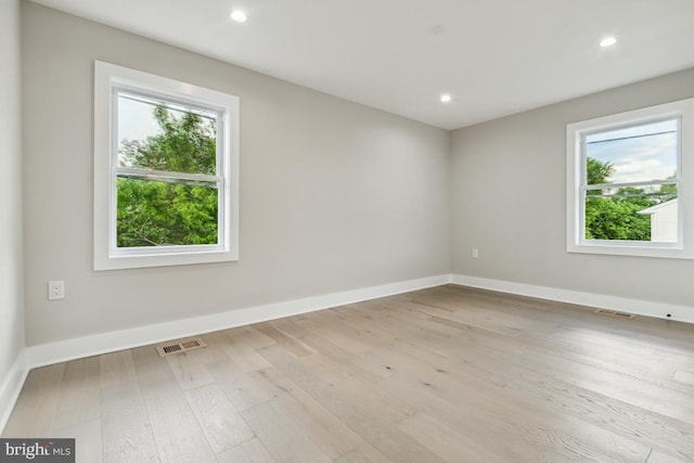 unfurnished room featuring light hardwood / wood-style flooring