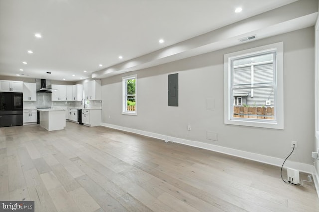 unfurnished living room with light hardwood / wood-style flooring