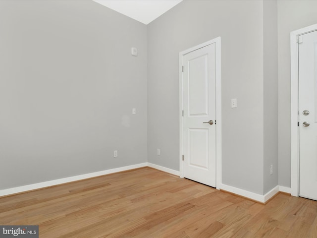 spare room featuring light wood-type flooring