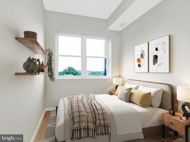 bedroom with wood-type flooring