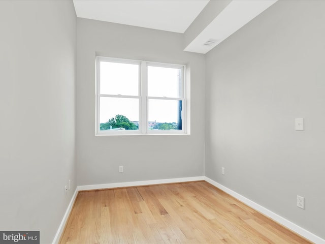 unfurnished room featuring light wood-type flooring