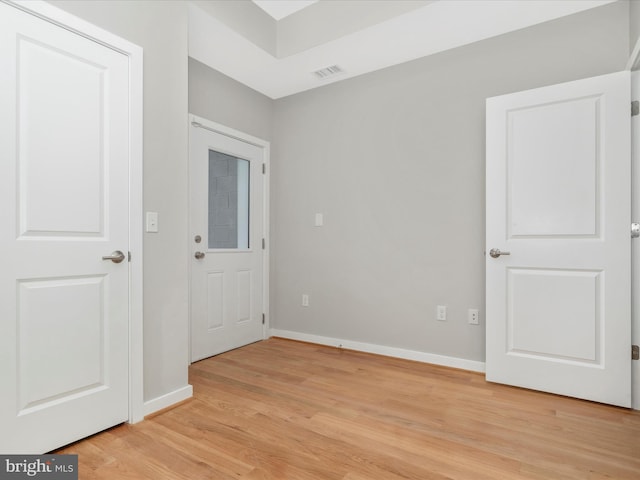 spare room with light wood-type flooring