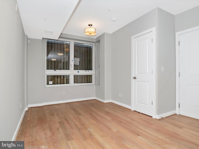 spare room featuring light hardwood / wood-style floors