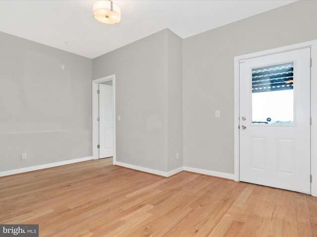 foyer entrance with light wood-type flooring