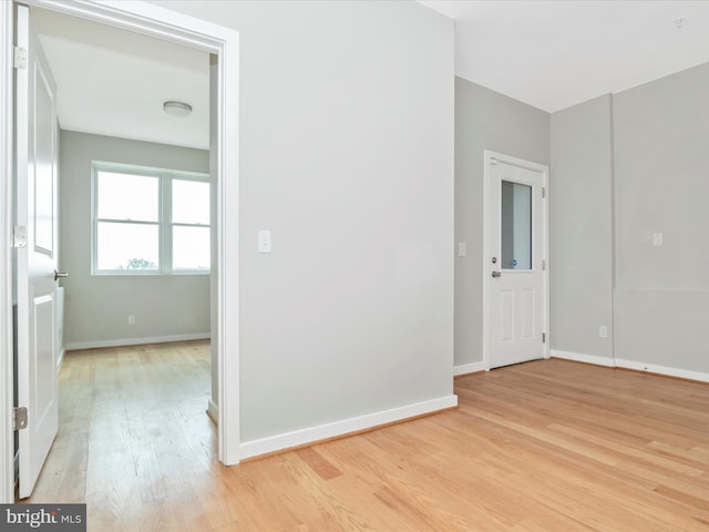 spare room featuring light hardwood / wood-style flooring