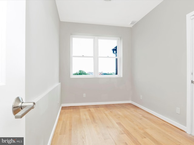 unfurnished room with light hardwood / wood-style flooring