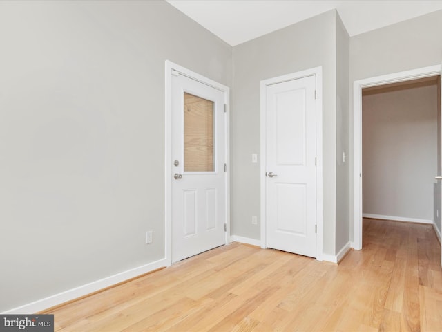 foyer entrance featuring light wood-type flooring