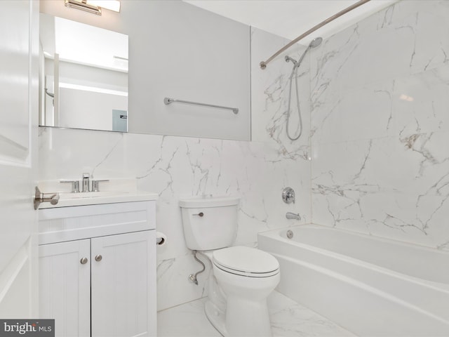 full bathroom with vanity, toilet, and tiled shower / bath