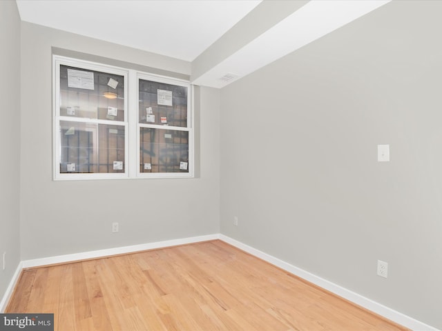 empty room featuring hardwood / wood-style floors