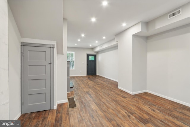 interior space with dark hardwood / wood-style floors