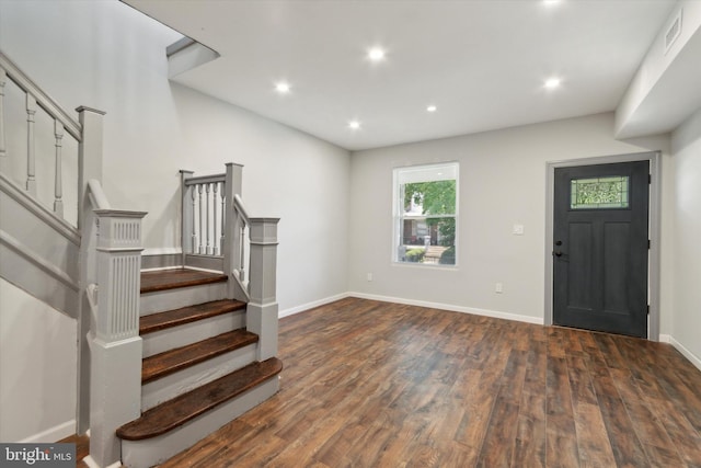 foyer featuring dark wood-type flooring