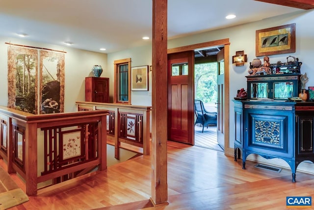 entryway featuring wood finished floors, visible vents, and recessed lighting