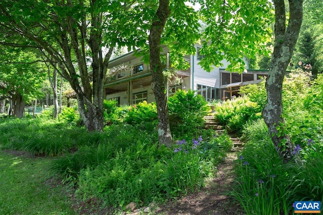 view of yard with a sunroom