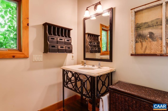 bathroom featuring vanity and baseboards