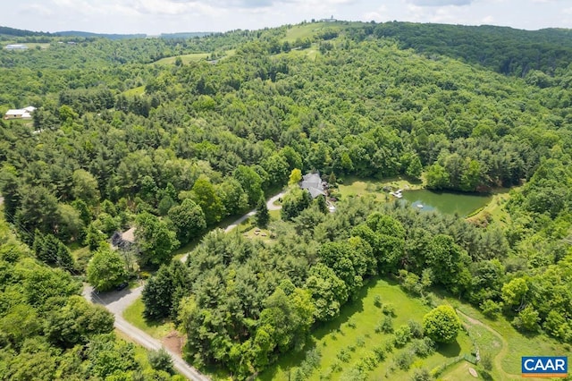 bird's eye view with a forest view and a water view