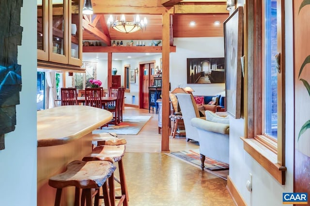 interior space with baseboards and a chandelier