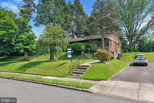 view of front of home with a front yard