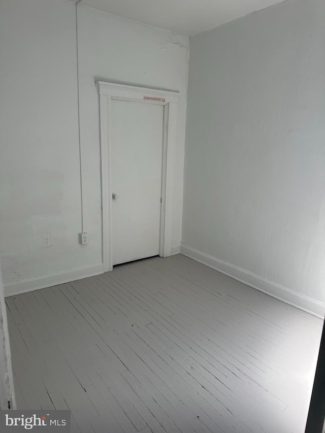 empty room with light hardwood / wood-style floors