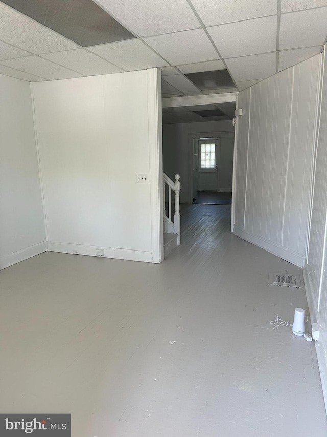 spare room featuring a paneled ceiling