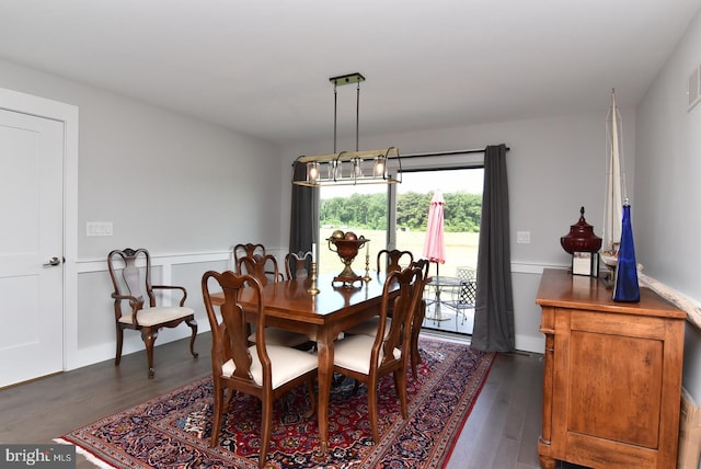 dining area with dark hardwood / wood-style floors