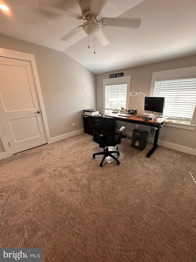 office area with carpet, plenty of natural light, ceiling fan, and lofted ceiling