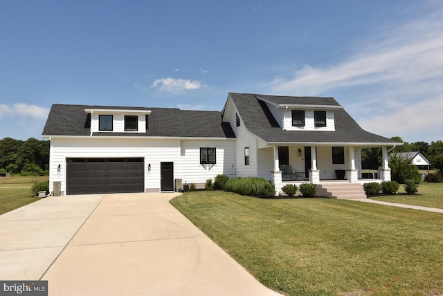 modern inspired farmhouse featuring a porch, a front yard, driveway, and a shingled roof