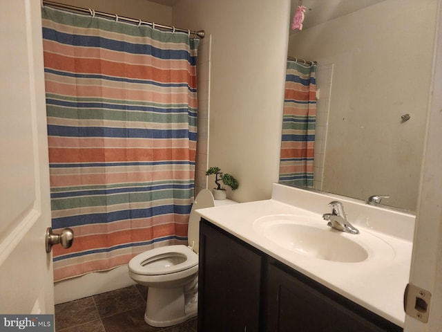 full bathroom with shower / bath combo, vanity, and toilet