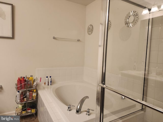 bathroom with tiled tub