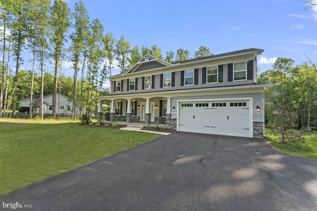 view of front facade with a porch, a garage, and a front yard