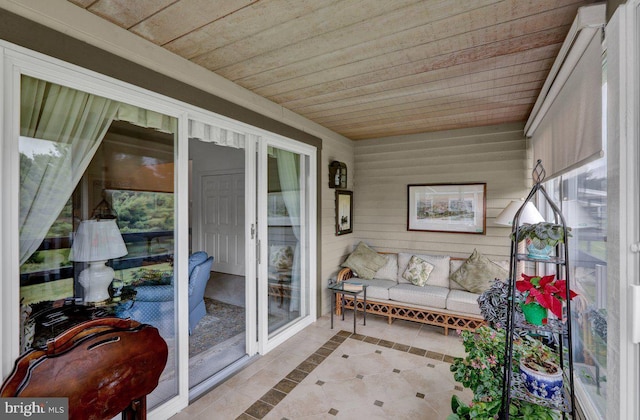 sunroom / solarium featuring wooden ceiling