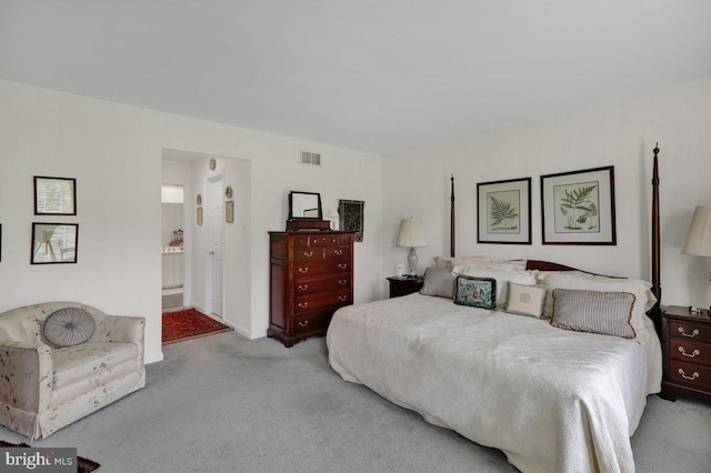 carpeted bedroom with connected bathroom