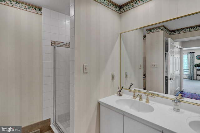 bathroom featuring vanity and walk in shower