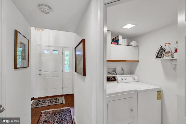 washroom with cabinets, hardwood / wood-style floors, and independent washer and dryer