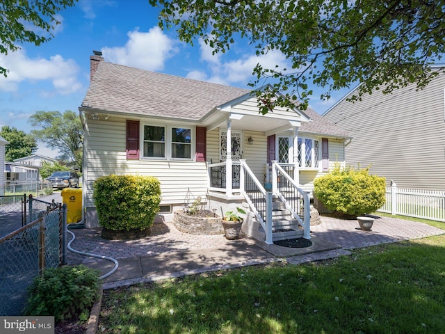 exterior space with a lawn and covered porch