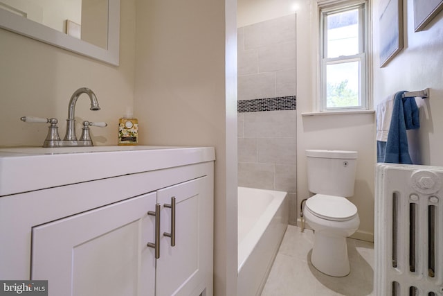 bathroom with tile patterned flooring, vanity, toilet, and radiator heating unit