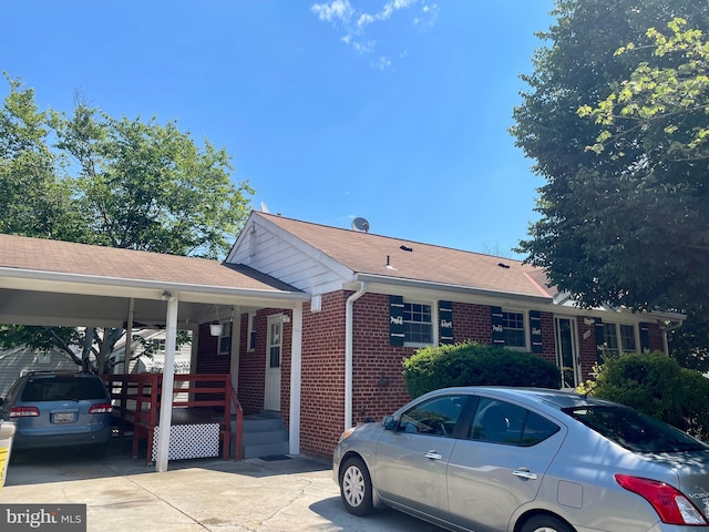 view of front of home with a carport