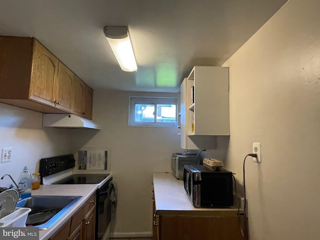 kitchen with white range with electric cooktop and sink