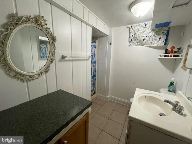 bathroom featuring tile patterned flooring, vanity, toilet, and a shower with shower curtain