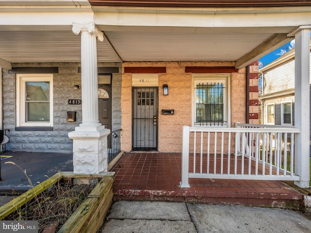 entrance to property with a porch