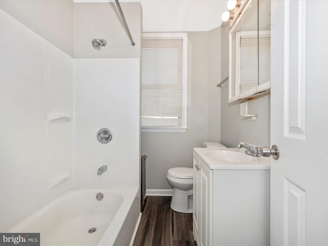 full bathroom featuring hardwood / wood-style floors, vanity, tub / shower combination, and toilet