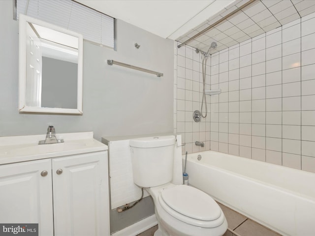 full bathroom with vanity, toilet, and tiled shower / bath