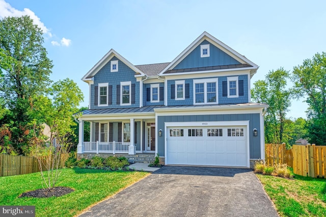 craftsman-style house with a porch, a garage, and a front lawn