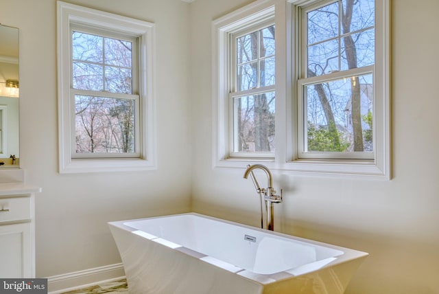 bathroom with a bath and vanity