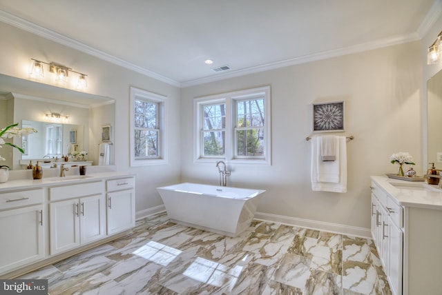 bathroom with a tub, crown molding, and vanity